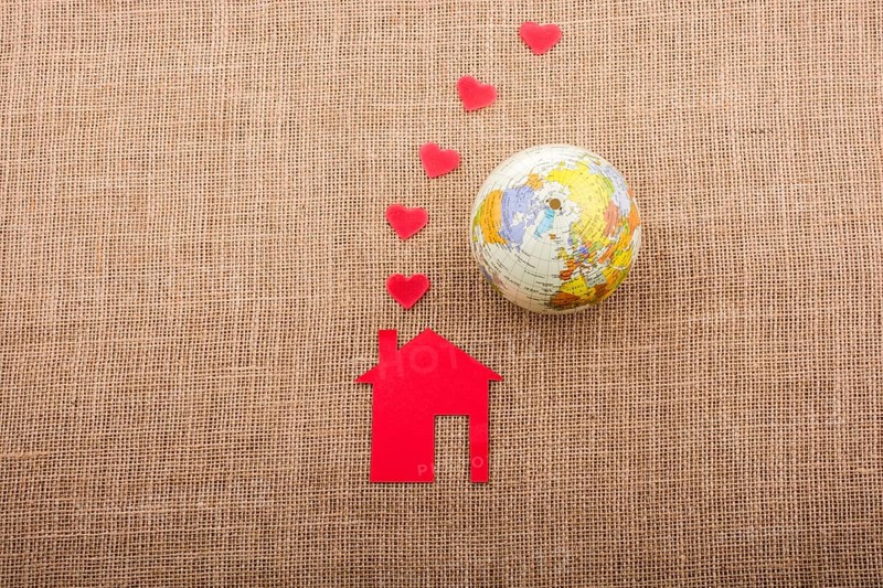 Heart shape coming out of chimney of paper house