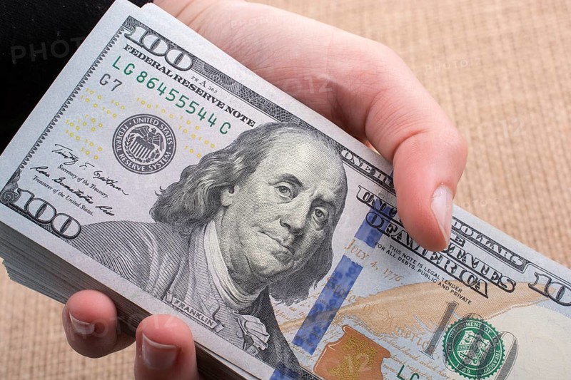 Close up of Benjamin Franklin face on 100 US dollar bill