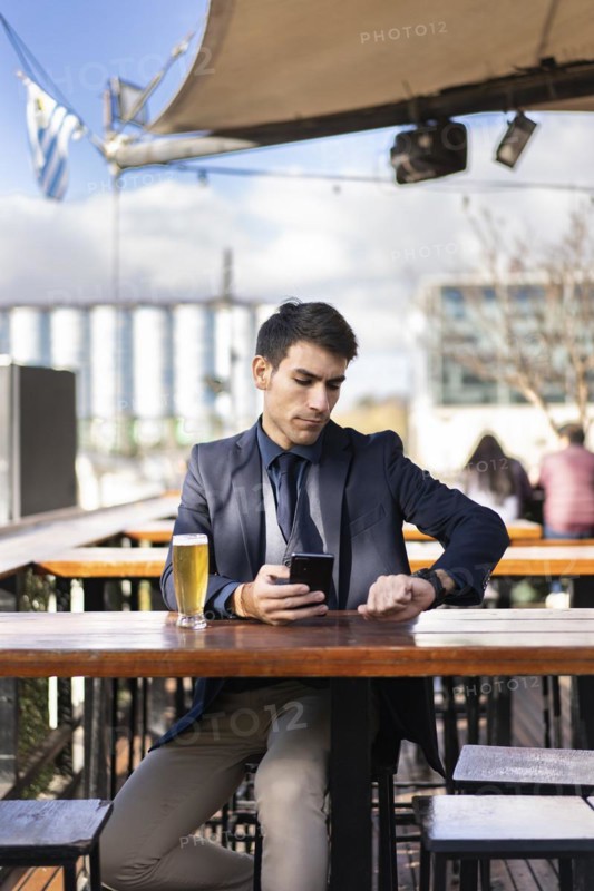 Businessman watching the time while waiting for a person