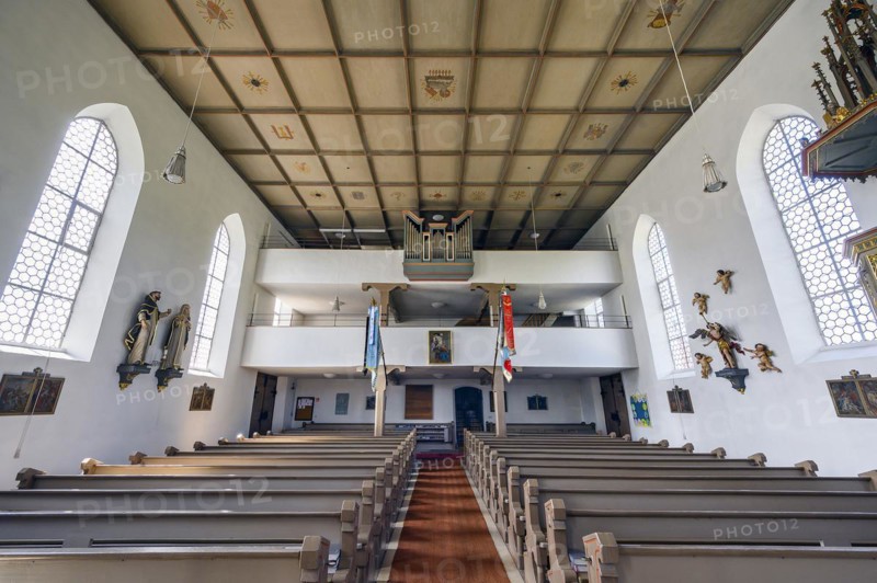 The organ loft of the Church of St Michael with coffered ceiling and flags