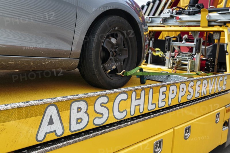 Writing towing service on tow truck