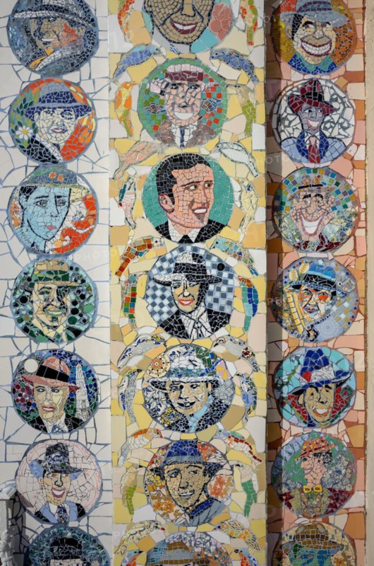 Detail of a mosaic façade with tango musicians