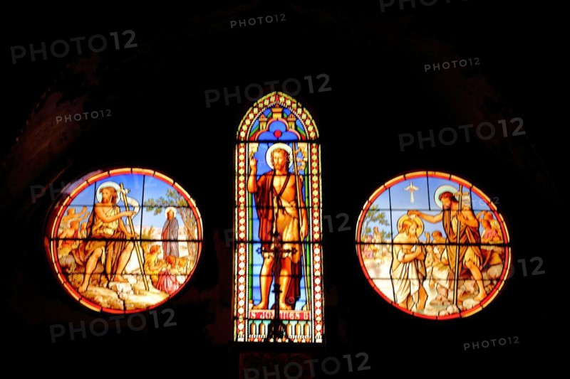 Three stained glass windows with John the Baptist of Saint-Dame-du-Bon-Remède Church