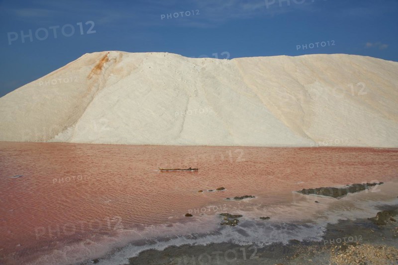 Salt mountain with water at saline for salt extraction