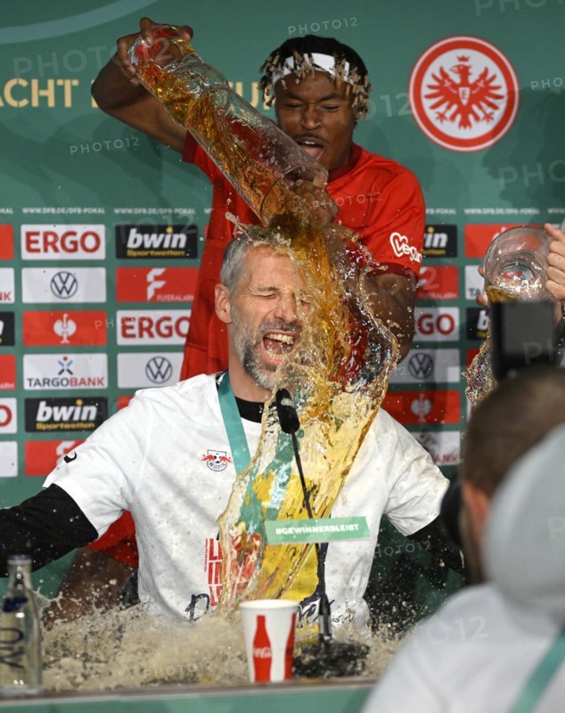 Beer shower during press conference PK for coach Coach Marco Rose by Mohamed Simakan