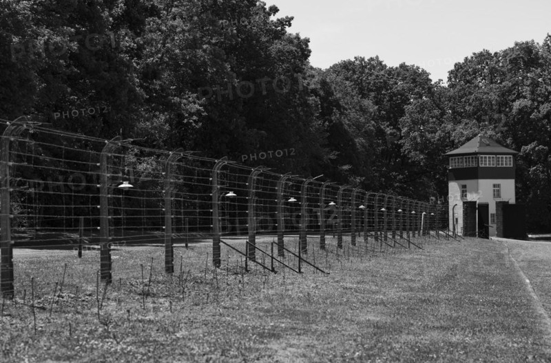 Reconstructed camp fence with watchtower