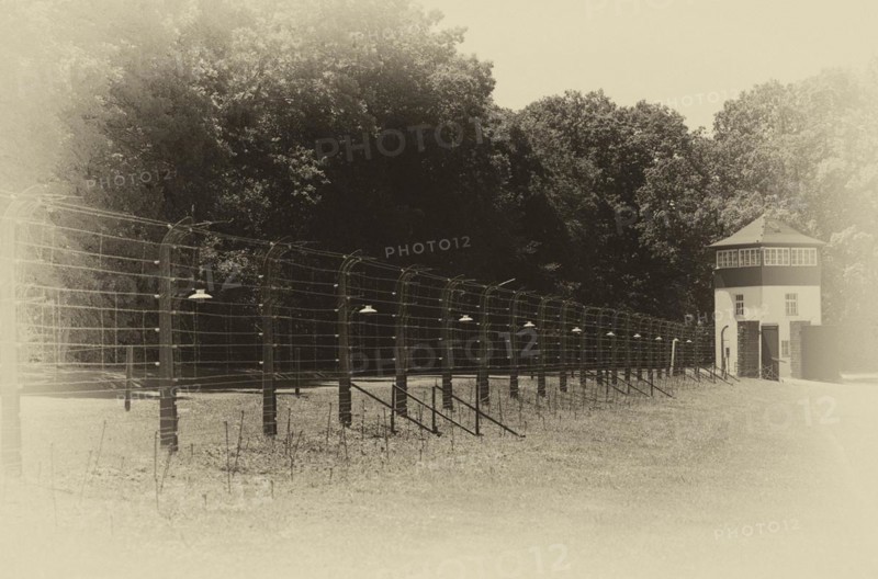 Reconstructed camp fence with watchtower