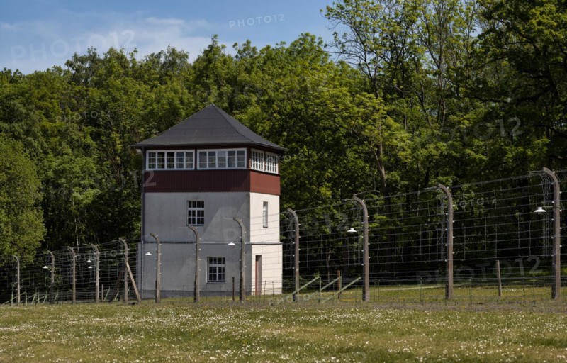 Reconstructed camp fence with watchtower