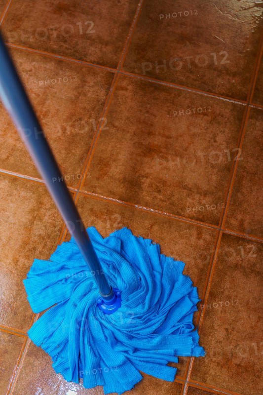 Top view of a blue mop mopping the floor