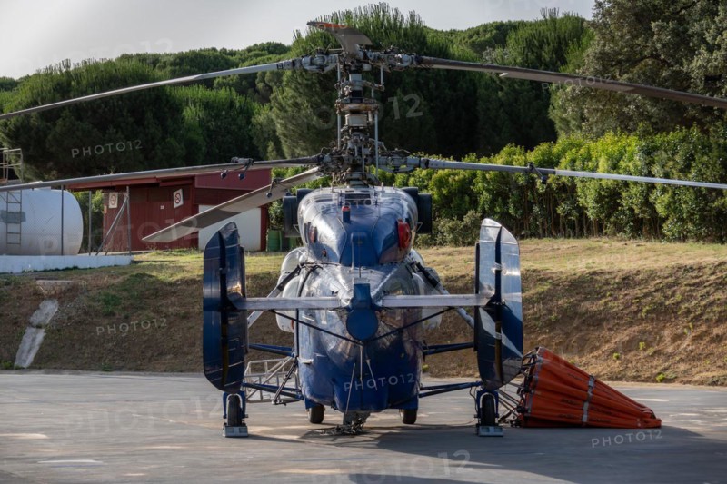 Firefighting helicopter parked at the heliport waiting for a forest fire warning