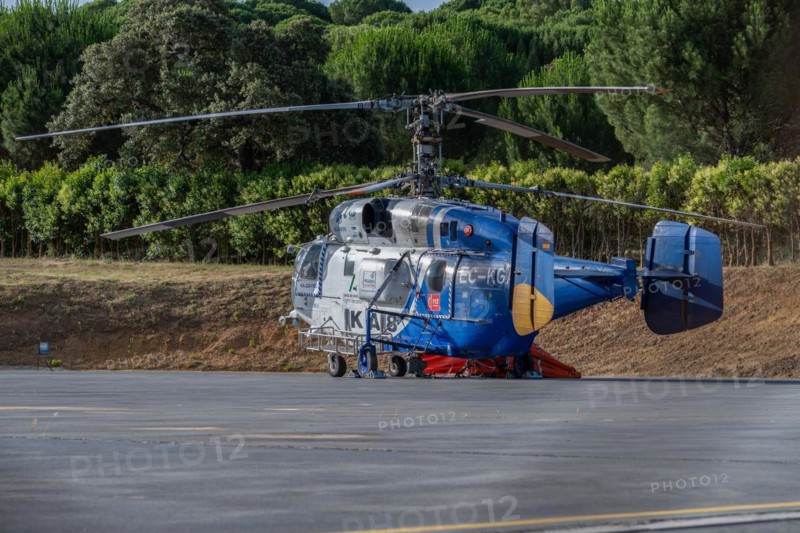 Firefighting helicopter parked at the heliport waiting for a forest fire warning