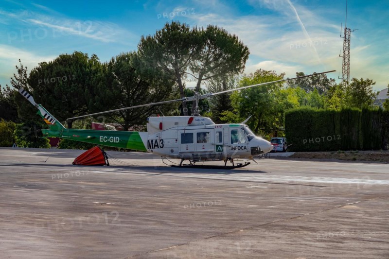 Firefighting helicopter parked at the heliport waiting for a forest fire warning
