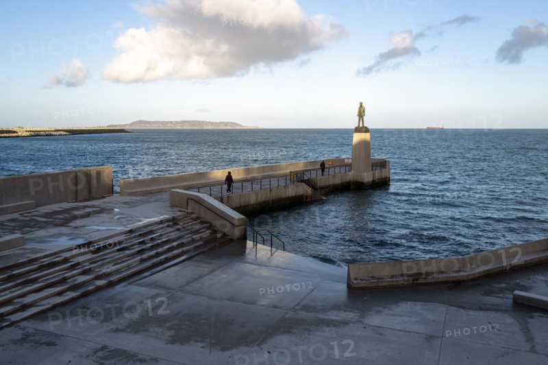 Walkers near the Roger Casement statue at Dun Laoghaire baths enjoy a fresh