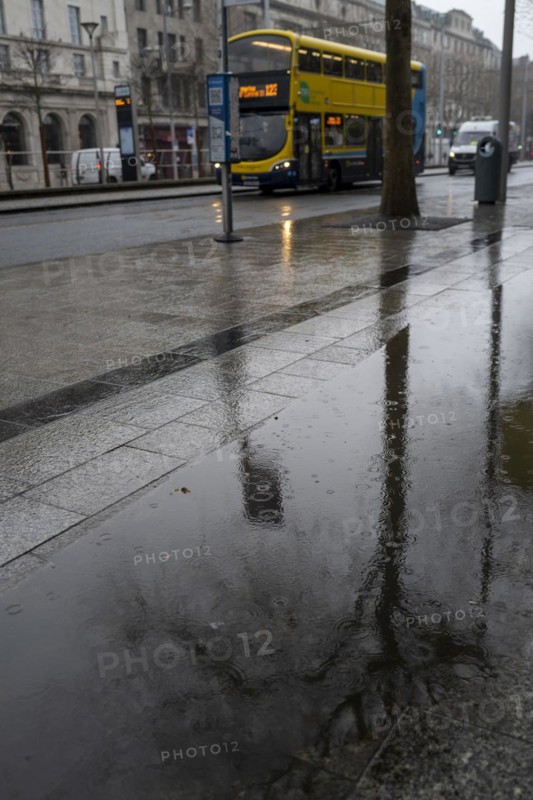 A Dublin bus passes by on a rainy day in January in the Irish capital city of Dublin