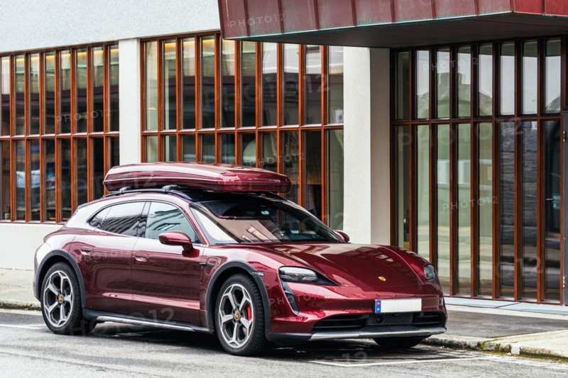 Brown Porsche Panamera with roof box