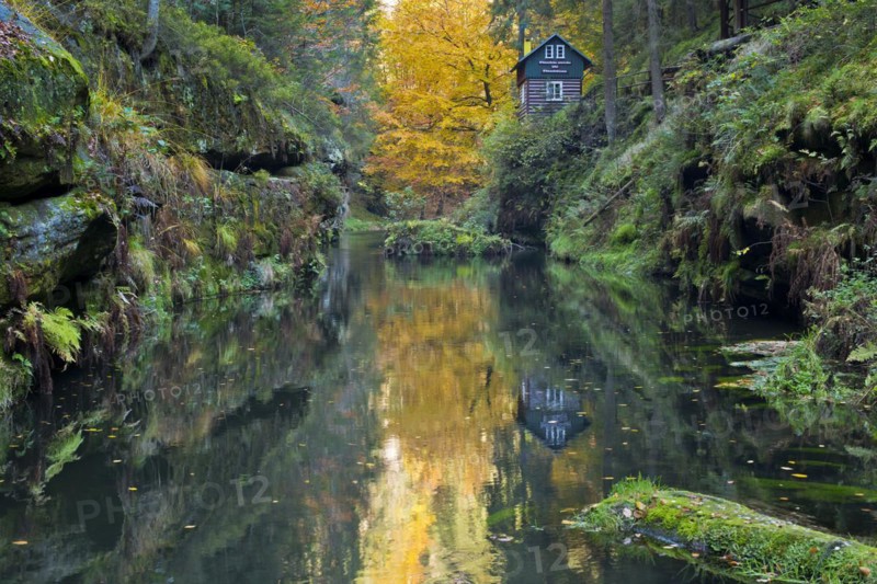 Autumn in the Edmundsklamm gorge with the river Kamenice