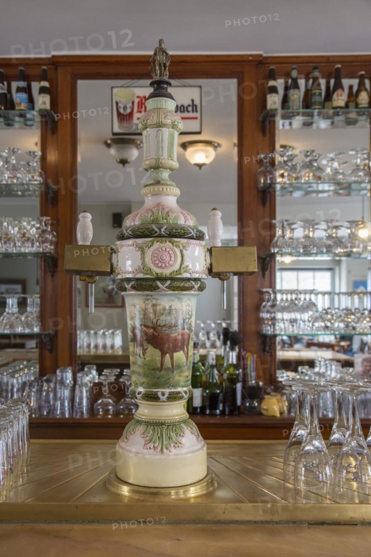 Vintage ceramic draft beer tap with two faucets in café In den Grooten Moriaen