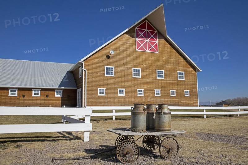 Traditional Mennonite dairy farm with old milk churns