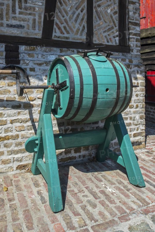 Old vintage wooden barrel-type butter churn