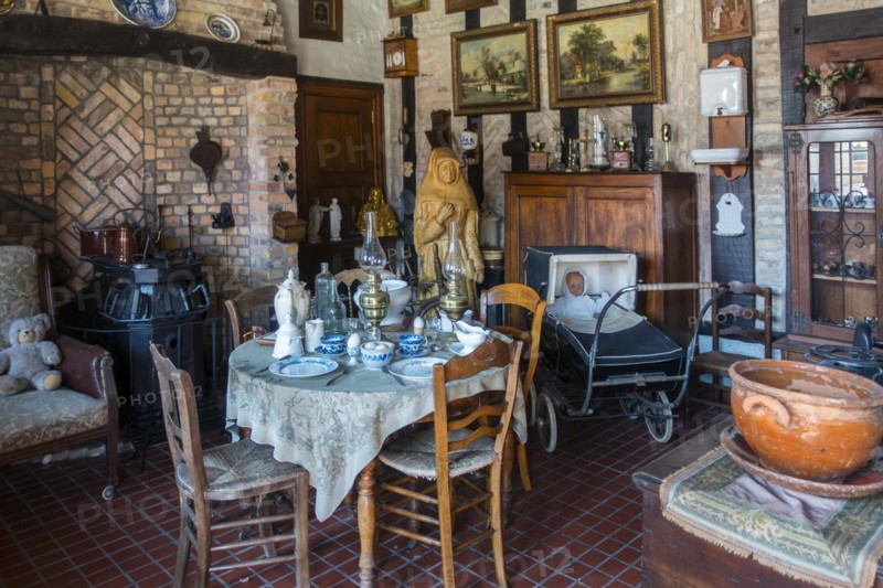 Old dining room with antique furniture and vintage chairs and table at the open air museum Bachten de Kupe