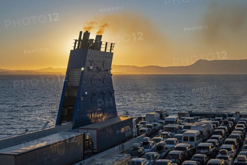 Car ferry from Grimaldi Lines sailing on the Adriatic Sea at sunset from Italy to Igoumenitsa in Greece