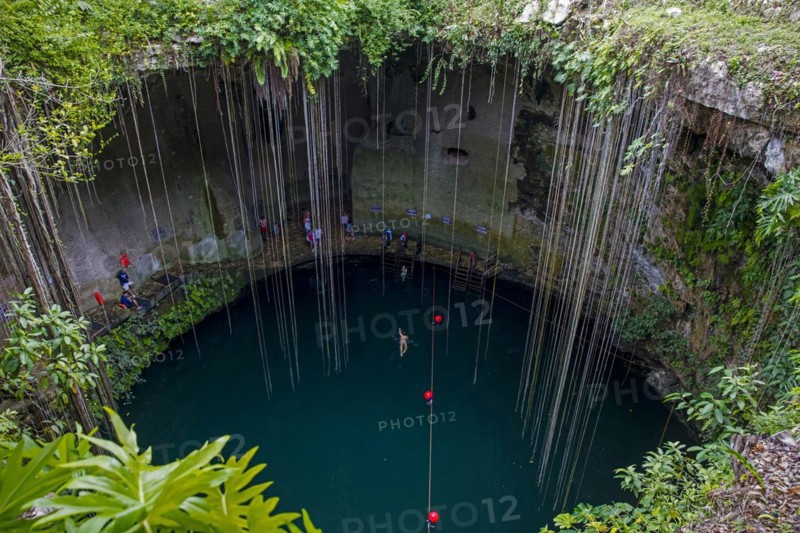 Tourists swimming in the Ik Kil Cenote