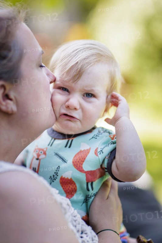 Mother comforting 11-month-old toddler