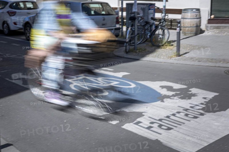 A cyclist rides over markings on a bicycle road in Berlin