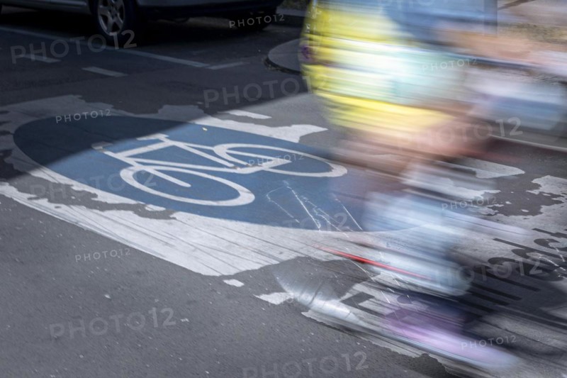 A cyclist rides over markings on a bicycle road in Berlin