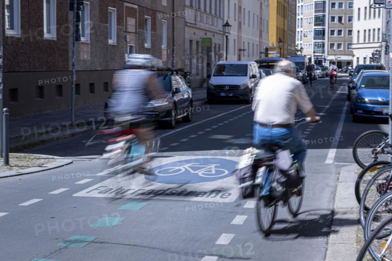 Cyclists riding over markings on a bicycle road in Berlin