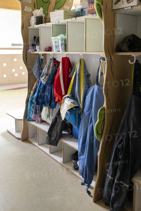 Jackets and shoes at a cloakroom in a kindergarten