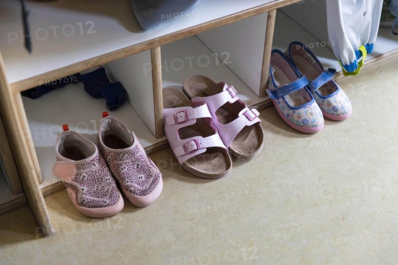 Shoes on a coat rack in a kindergarten