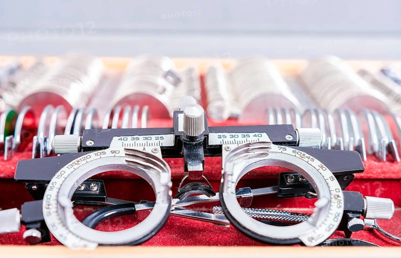 Diopter lens with lenses in ophthalmological test box. Ophthalmological messbrille and lens kit