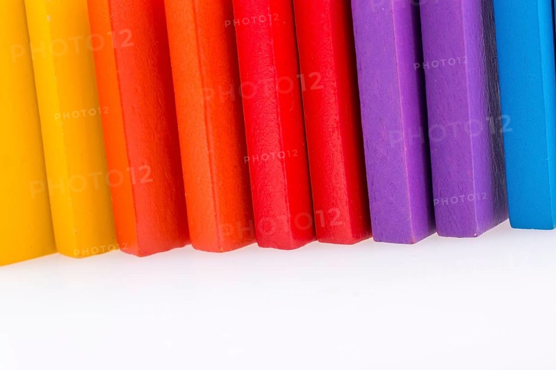 Colorful Domino Blocks in a line on a white background
