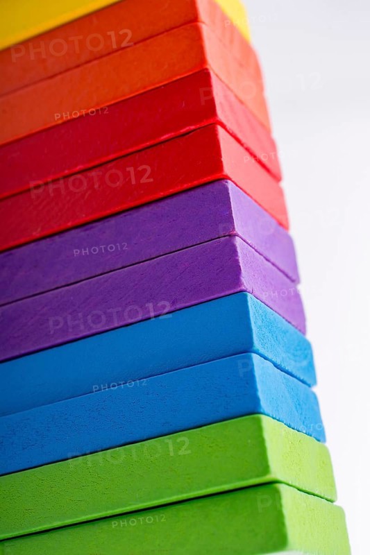Colorful Domino Blocks in a line on a white background