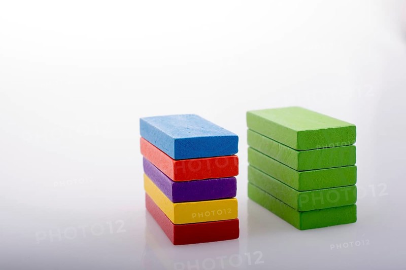 Colorful Domino Blocks in a line on a white background