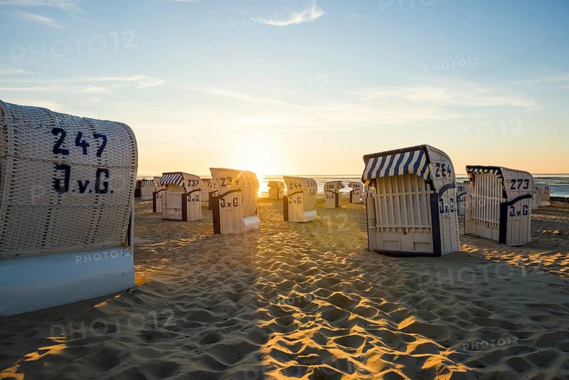 White beach chairs and mudflats
