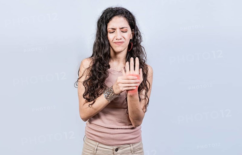 Woman suffering from arthritis in her hands. People with arthritis and hand pain isolated