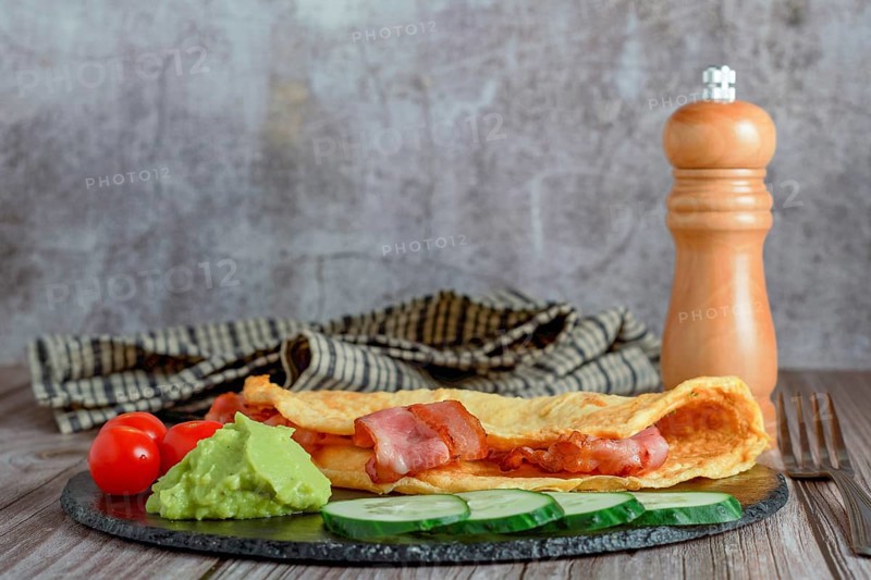 Bacon stuffed omelette with cucumber
