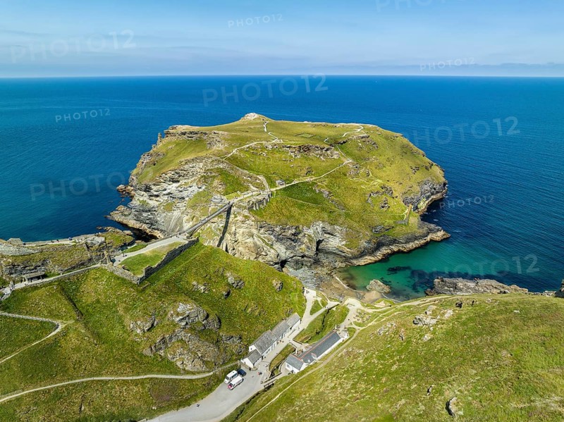 Aerial view of the rugged coastline on the Celtic Sea with the Tintagel Peninsula and the ruins of Tintagel Castle