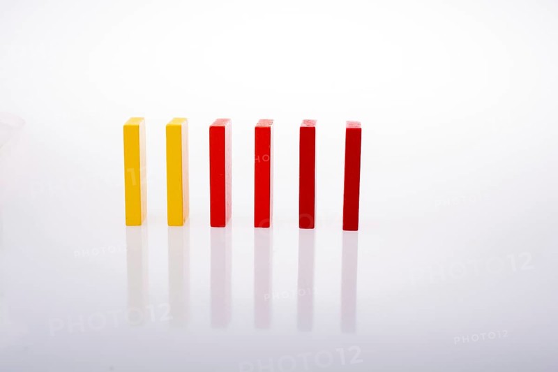 Colorful Domino Blocks in a line on a white background