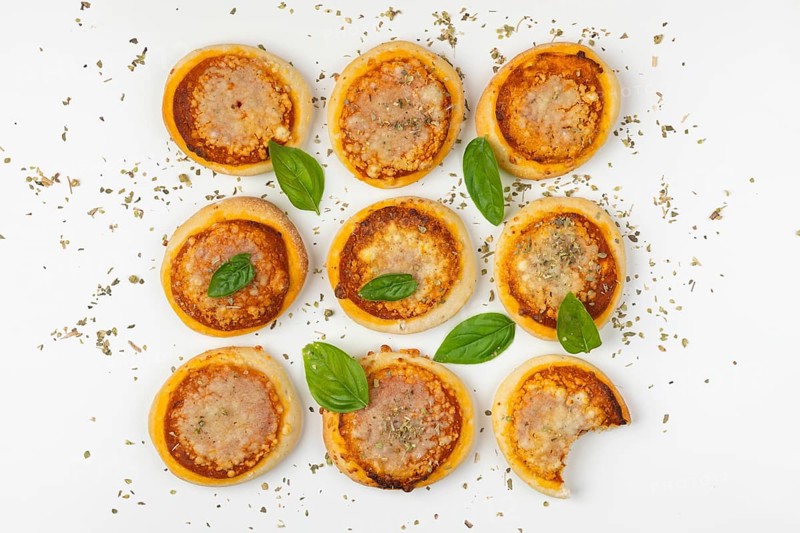 Nine small Margherita pizzas