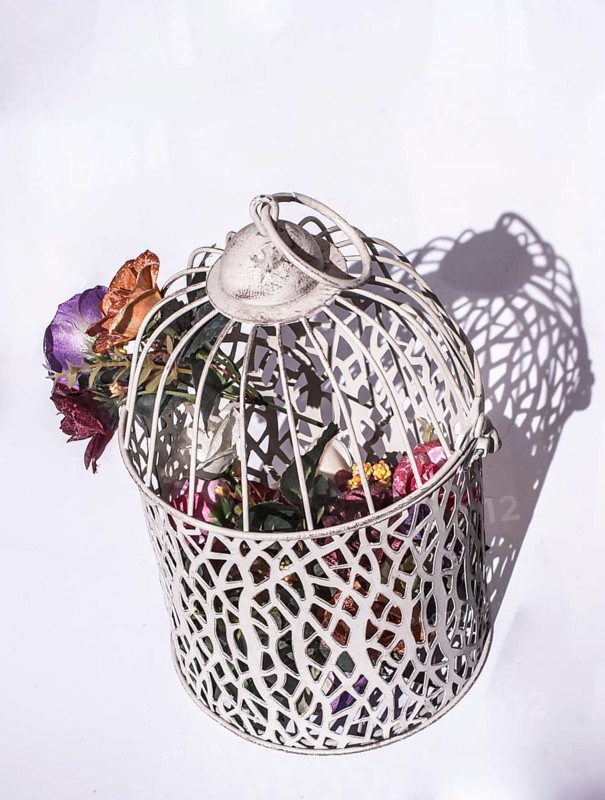 Little white bird house made of metal