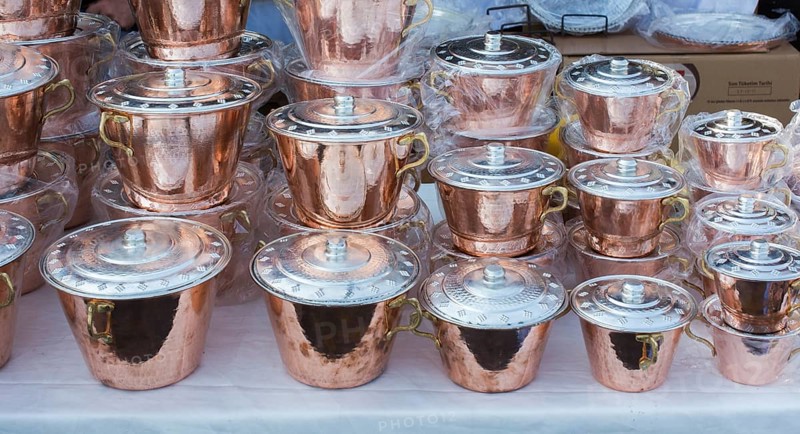 Little set of buckets of made of metal in a market place