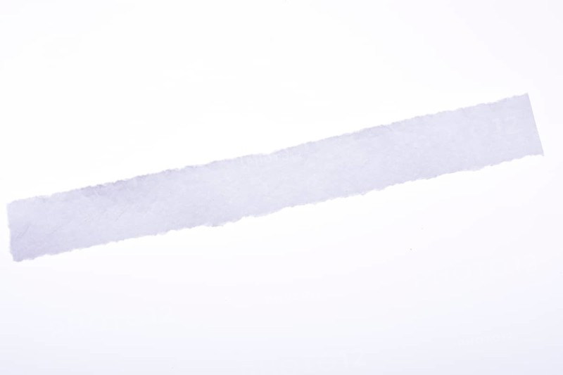 A piece of white blank torn note paper