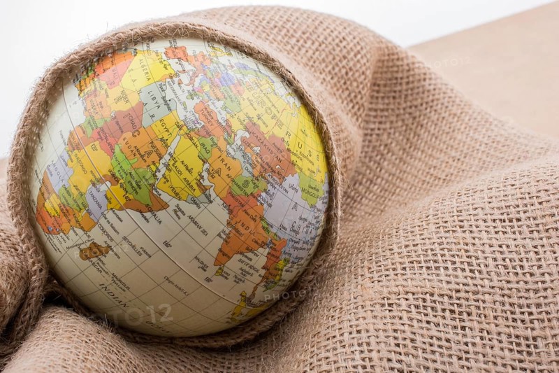 Linen canvas is wrapped around a model globe