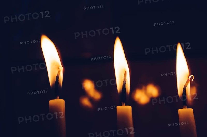 Burning candle making light in view