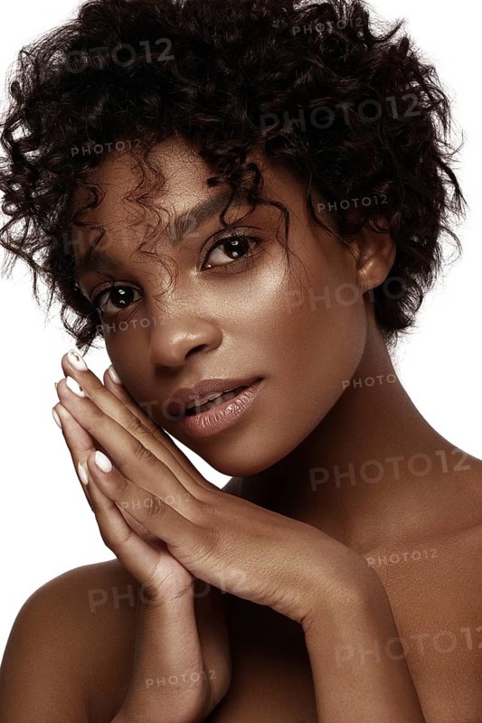 African American skincare models with perfect skin and curly hair. Beauty spa treatment concept