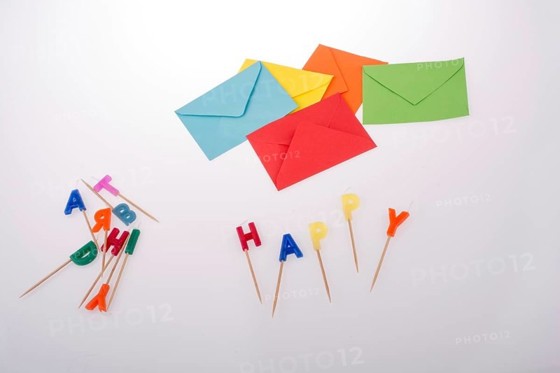 Colored envelopes and Color candles on sticks write happy
