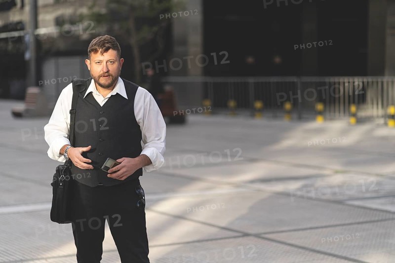 Business man posing on the street